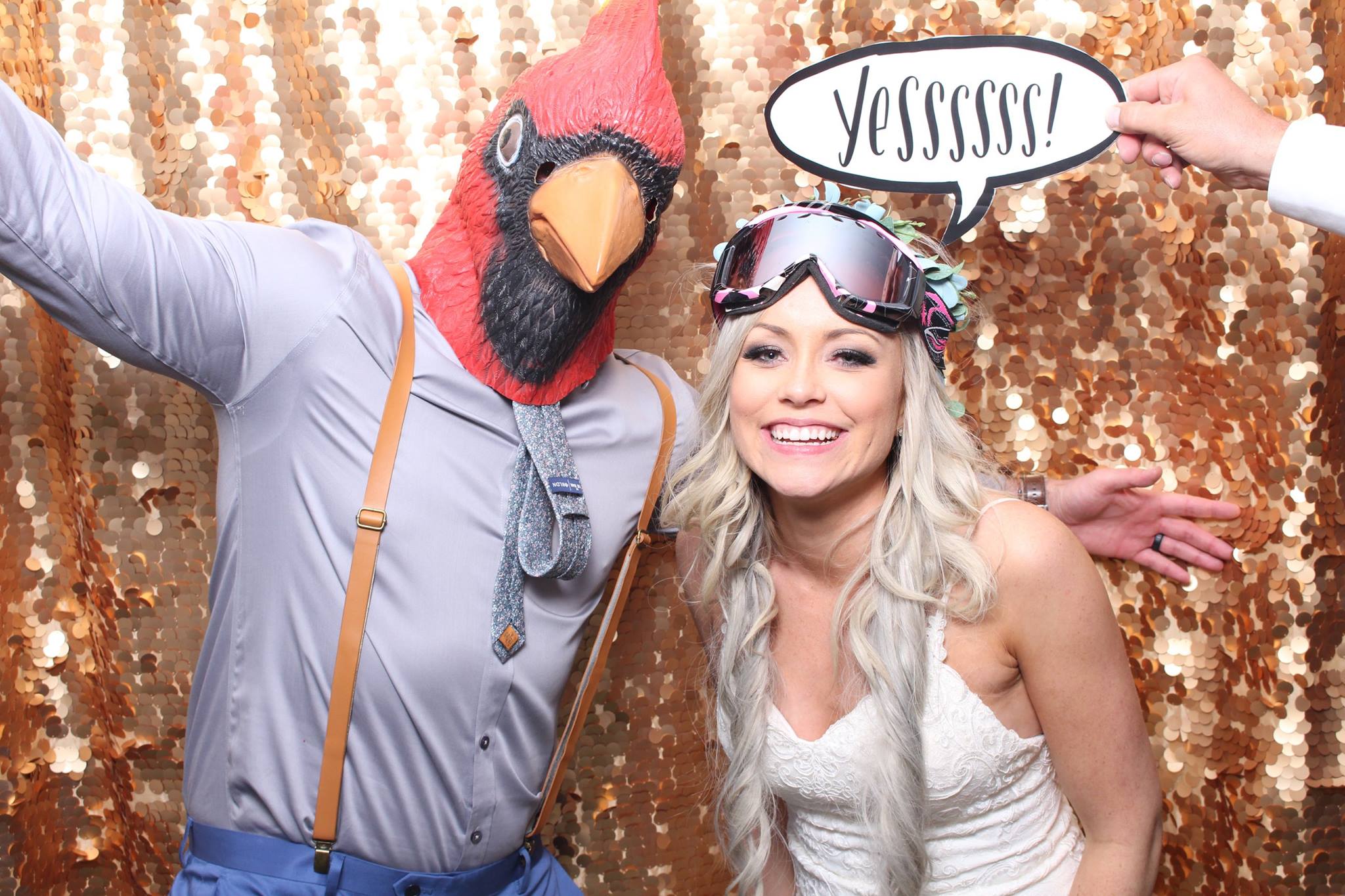 A married couple enjoying a photobooth picture